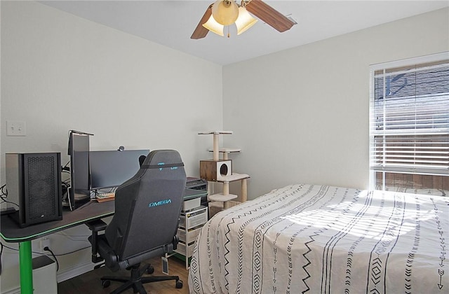 bedroom featuring wood-type flooring and ceiling fan