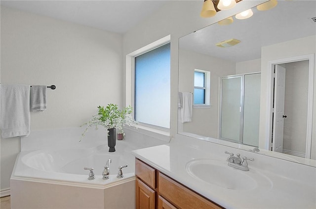 bathroom with plus walk in shower and vanity