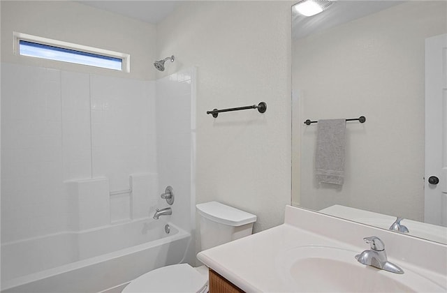 full bathroom with washtub / shower combination, vanity, and toilet