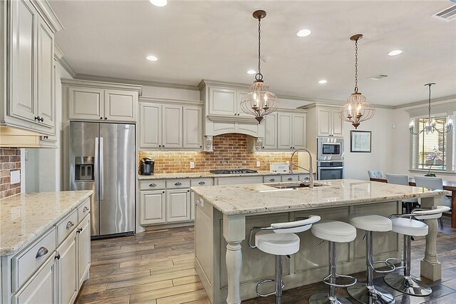 4111 Downton Abbey Ave, College Station, TX 77845 - kitchen with a sink, stainless steel appliances, decorative backsplash, visible vents, and dark wood-style floors