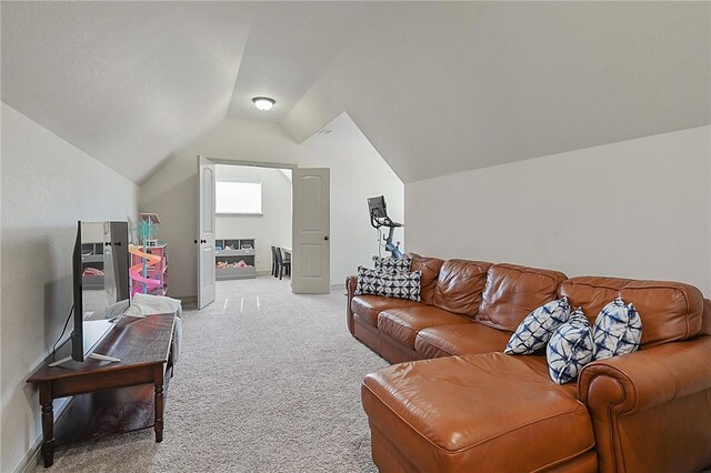 4111 Downton Abbey Ave, College Station, TX 77845 - living area featuring baseboards, light carpet, and vaulted ceiling