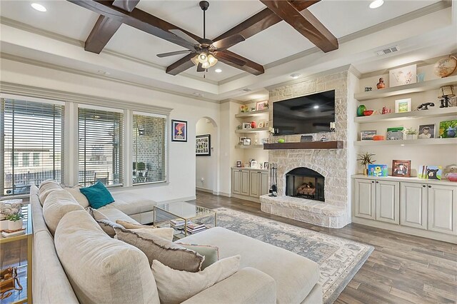 4111 Downton Abbey Ave, College Station, TX 77845 - living area featuring arched walkways, a ceiling fan, visible vents, and coffered ceiling