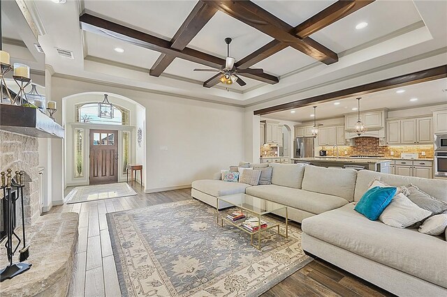 4111 Downton Abbey Ave, College Station, TX 77845 - living room featuring a ceiling fan, visible vents, beam ceiling, baseboards, and coffered ceiling