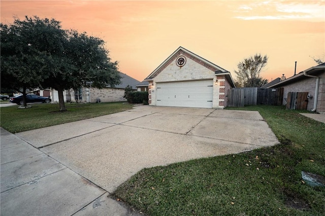 exterior space with a yard and a garage