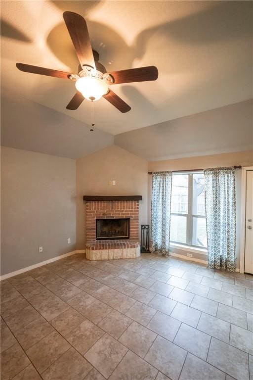 unfurnished living room featuring ceiling fan, tile patterned flooring, lofted ceiling, and a brick fireplace