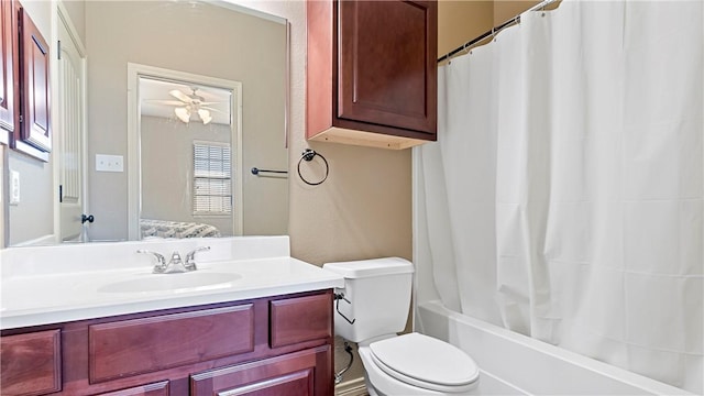 full bathroom with ceiling fan, vanity, shower / tub combo, and toilet