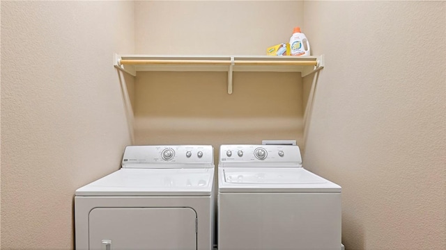 washroom featuring washer and clothes dryer