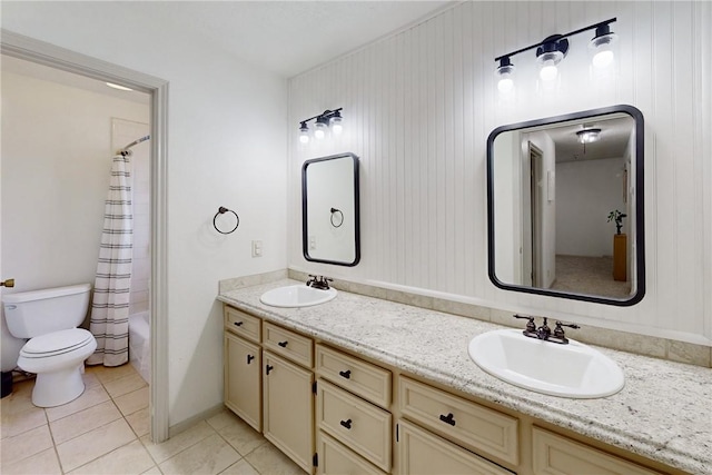 full bathroom featuring tile patterned flooring, wood walls, toilet, shower / tub combo with curtain, and vanity