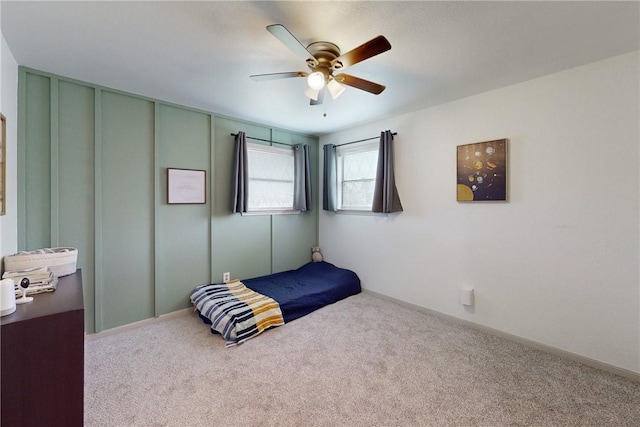 bedroom with ceiling fan and carpet floors