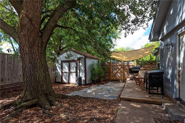 exterior space featuring a shed and a wooden deck