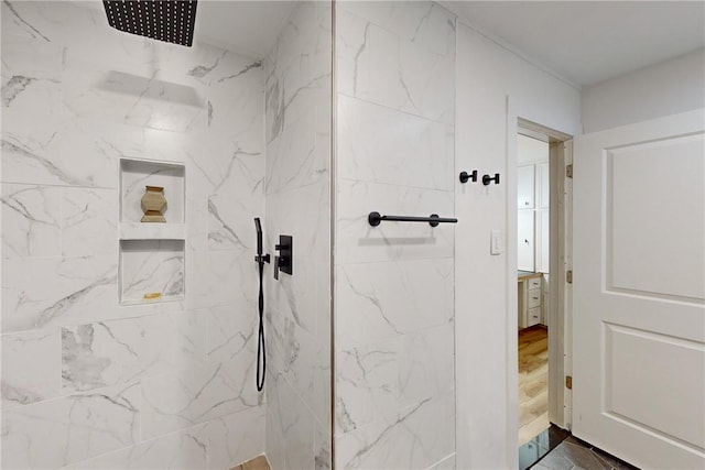 bathroom featuring a tile shower