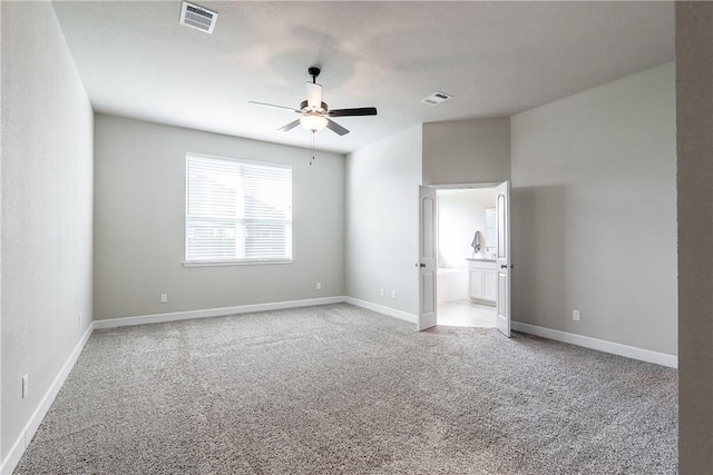 carpeted empty room with ceiling fan