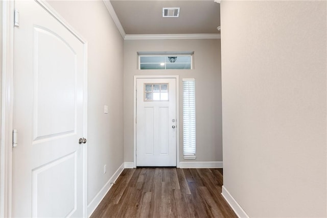 foyer with dark hardwood / wood-style flooring, crown molding, and a healthy amount of sunlight