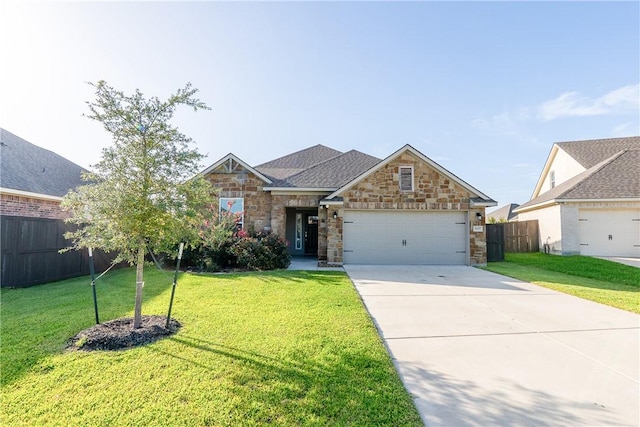 view of front of property with a front lawn and a garage