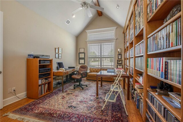 office with beamed ceiling, wood-type flooring, high vaulted ceiling, and ceiling fan