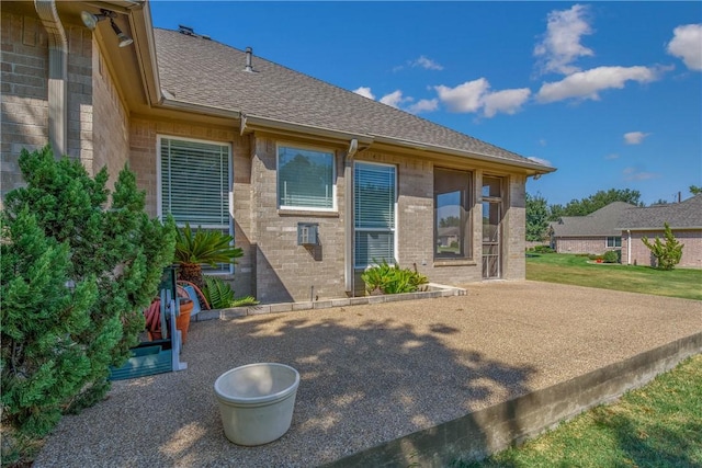 rear view of house featuring a patio