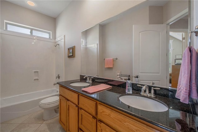 full bathroom featuring tile patterned floors, vanity, toilet, and tub / shower combination