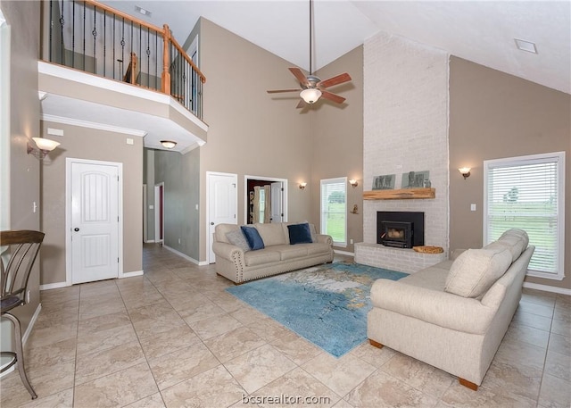 living room with ceiling fan, high vaulted ceiling, and a brick fireplace