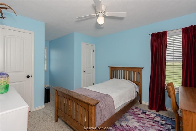 bedroom with light carpet and ceiling fan