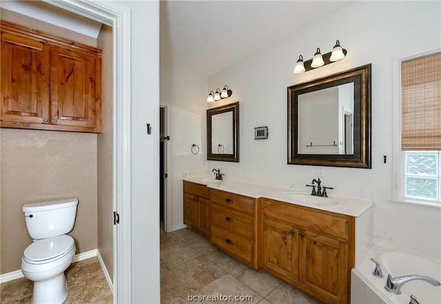 bathroom featuring a tub to relax in, tile patterned floors, vanity, and toilet