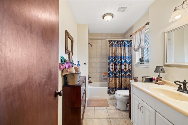 full bathroom featuring tile patterned flooring, shower / bath combo, toilet, and vanity