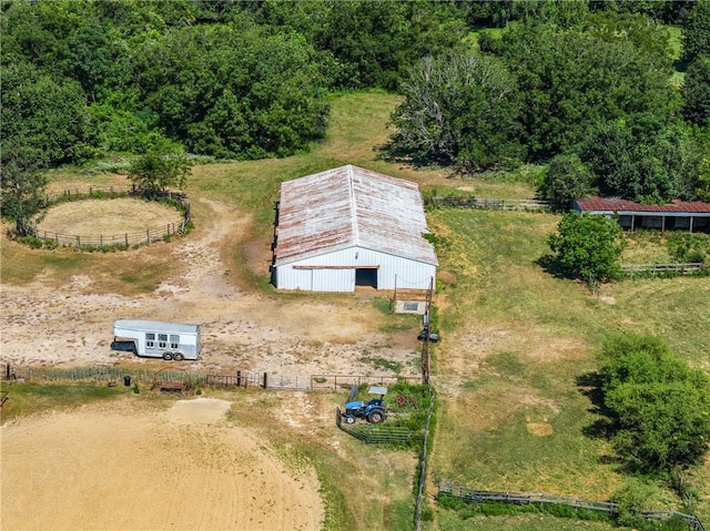 birds eye view of property with a rural view