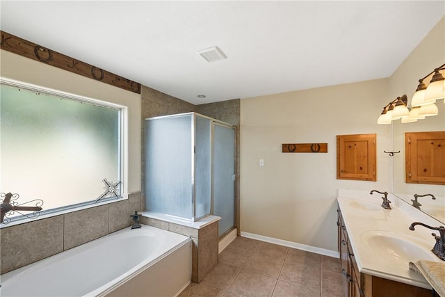 bathroom featuring tile patterned flooring, vanity, and plus walk in shower