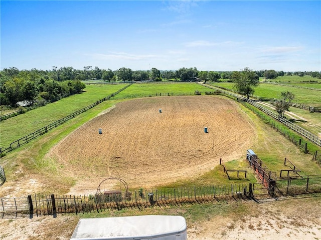 birds eye view of property with a rural view