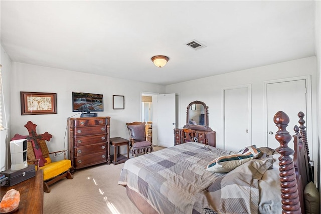bedroom with light colored carpet
