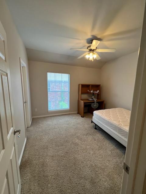 carpeted bedroom featuring ceiling fan