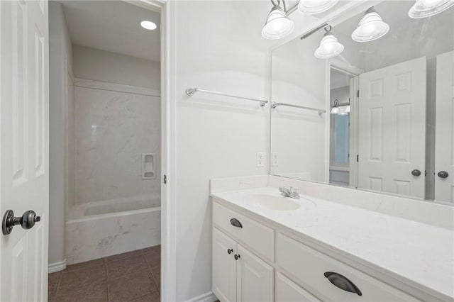 full bath featuring vanity, shower / tub combination, tile patterned flooring, and baseboards