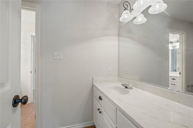 bathroom with tile patterned floors and vanity