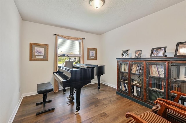 2074 Positano Loop, Bryan, TX 77808 - miscellaneous room featuring a textured ceiling and hardwood / wood-style flooring