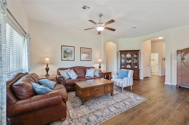 living room featuring ceiling fan and hardwood / wood-style floors