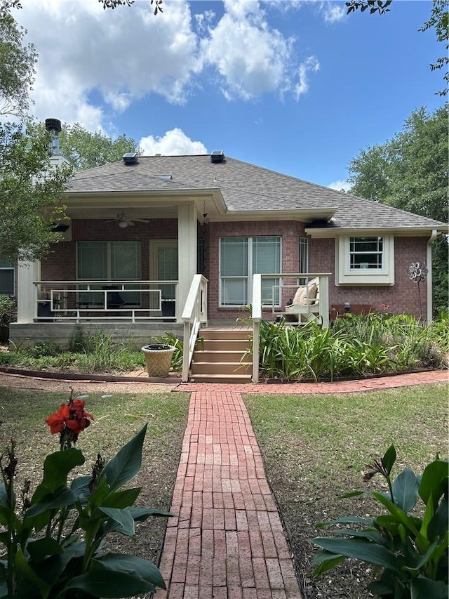 2020 Carter Lake Dr, College Station, TX 77845 - view of front of home featuring brick siding, ceiling fan, covered porch, and roof with shingles