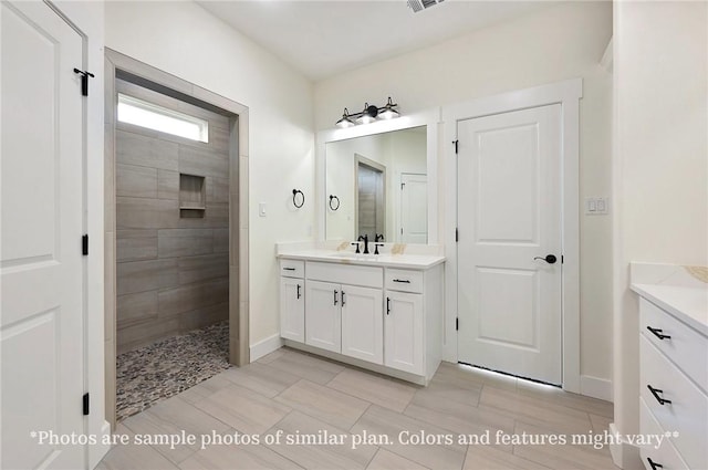 436 Brazos Bnd, Snook, TX 77879 - bathroom featuring vanity, walk in shower, and baseboards