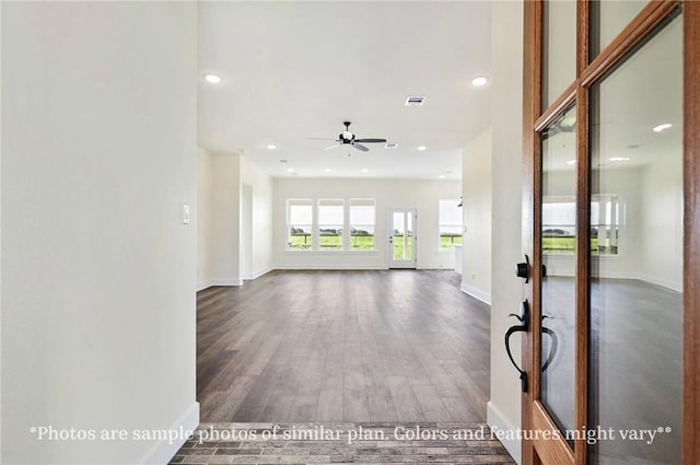 436 Brazos Bnd, Snook, TX 77879 - unfurnished living room featuring baseboards, wood finished floors, recessed lighting, ceiling fan, and french doors