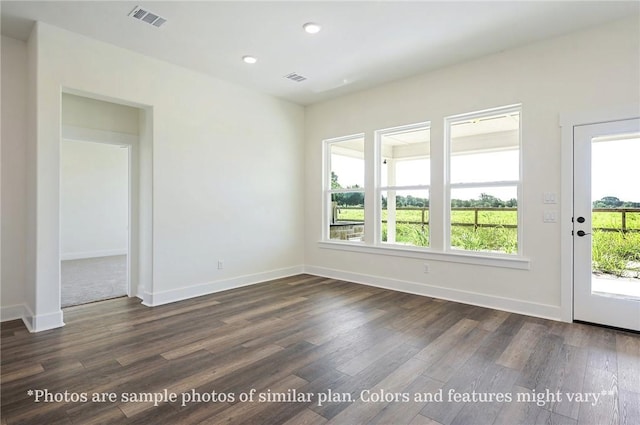 436 Brazos Bnd, Snook, TX 77879 - spare room featuring dark wood-style floors, baseboards, and recessed lighting