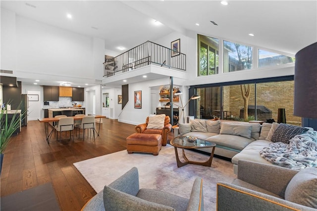23 Forest Dr, College Station, TX 77840 - living room featuring high vaulted ceiling, dark wood finished floors, baseboards, and recessed lighting
