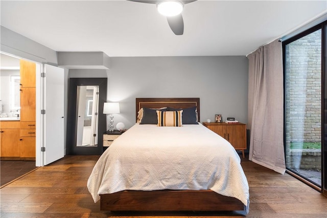 23 Forest Dr, College Station, TX 77840 - bedroom featuring dark wood-style flooring, ensuite bathroom, a ceiling fan, and access to exterior