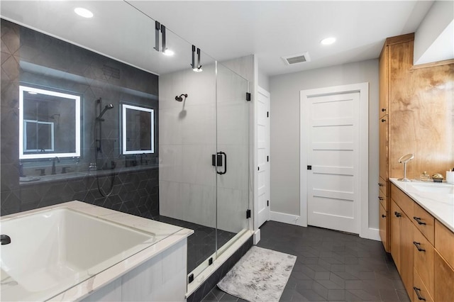 23 Forest Dr, College Station, TX 77840 - bathroom with a stall shower, vanity, recessed lighting, tile patterned flooring, and a bathtub