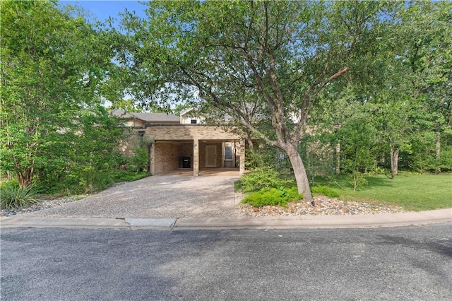 23 Forest Dr, College Station, TX 77840 - view of front facade with a carport, asphalt driveway, and a front yard
