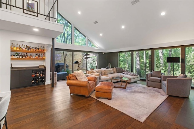 23 Forest Dr, College Station, TX 77840 - living area with high vaulted ceiling, a dry bar, hardwood / wood-style floors, and recessed lighting