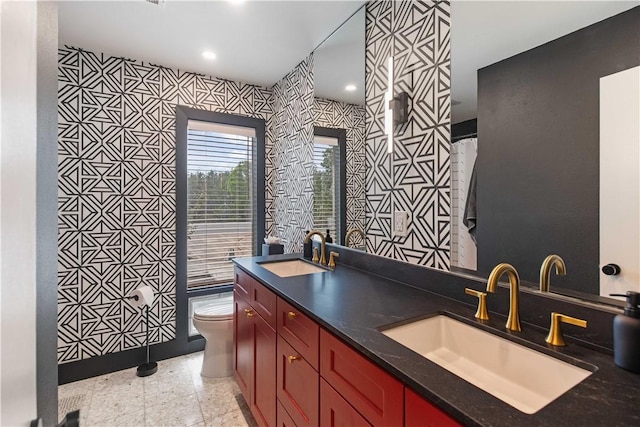 23 Forest Dr, College Station, TX 77840 - bathroom featuring toilet, double vanity, and recessed lighting