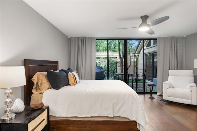 23 Forest Dr, College Station, TX 77840 - bedroom with wood finished floors, access to outside, a wall of windows, and ceiling fan