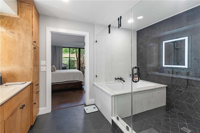 23 Forest Dr, College Station, TX 77840 - full bath featuring tile patterned floors, a shower stall, ensuite bathroom, recessed lighting, and vanity