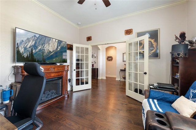 home office featuring french doors, dark hardwood / wood-style floors, ceiling fan, and ornamental molding