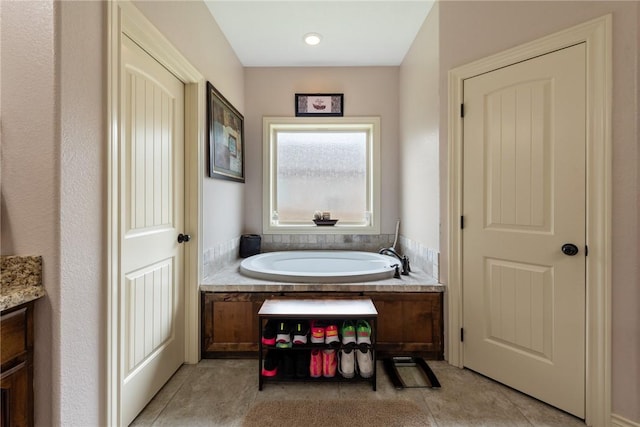 bathroom featuring a bathing tub and vanity