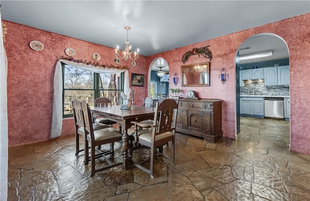 dining room with a notable chandelier