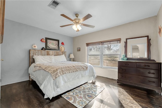 bedroom with dark wood-type flooring and ceiling fan